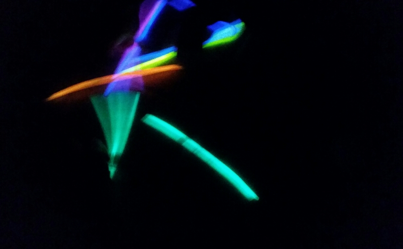 blurry colorful glow sticks